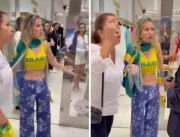 Seguranças de shopping de luxo abordam mulher vestindo bandeira do Brasil